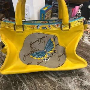 Junior Drake Vibrant Yellow Satchel with Blue Butterfly has wear stains